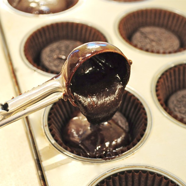 Scoop brownie batter over Oreo.