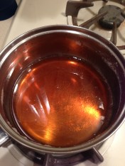 Making caramel cream- boil until browned.