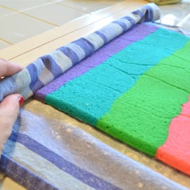 Roll cake in towel, starting at short end.