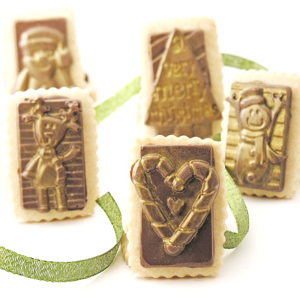 Shortbread cutout cookies with chocolate on top.